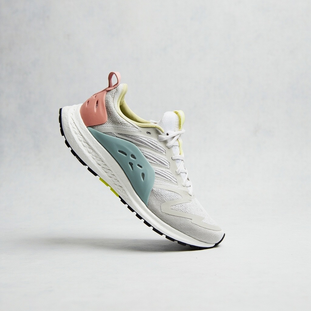 Editorial detail of an entry-level running shoe upper showing engineered mesh panels and synthetic overlays